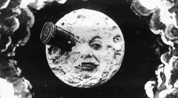 An iconic image in the History of Photography showing a moon with a face and a rocket in one eye from the 1902 film 'A Trip to the Moon'
