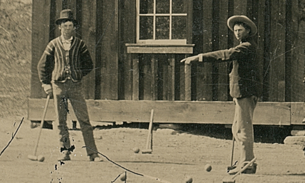 Close up of tintype of Billy the Kid playing croquet