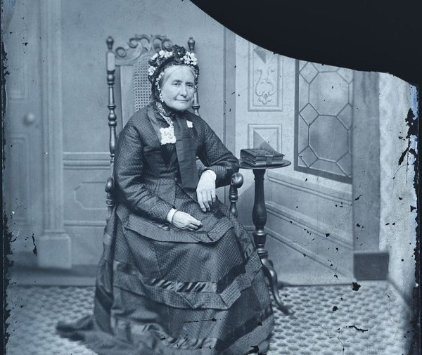 Old glass negative of Victorian lady seated (cropped)