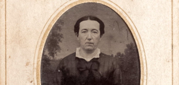 Vintage tintype of a victorian woman in paper sleeve (cropped)